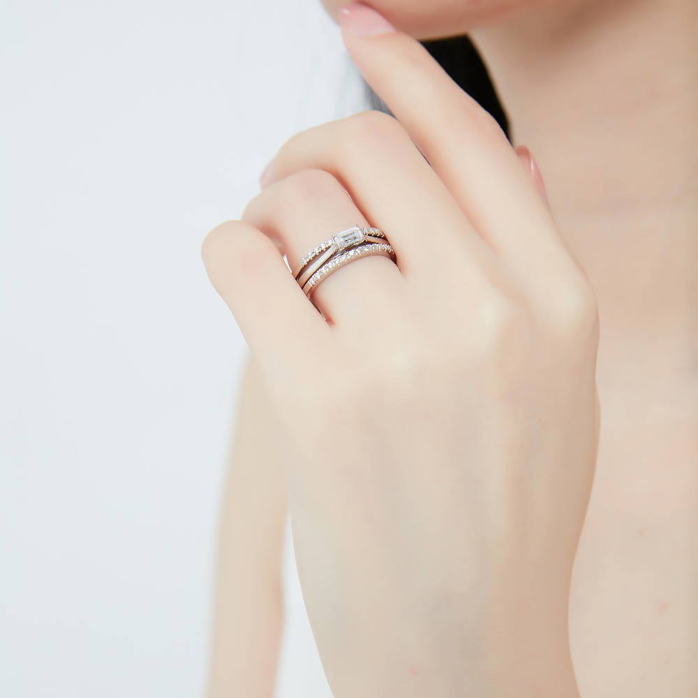 Model wearing Solitaire East-West 0.3ct Emerald Cut CZ Ring in Sterling Silver, 12 of 13