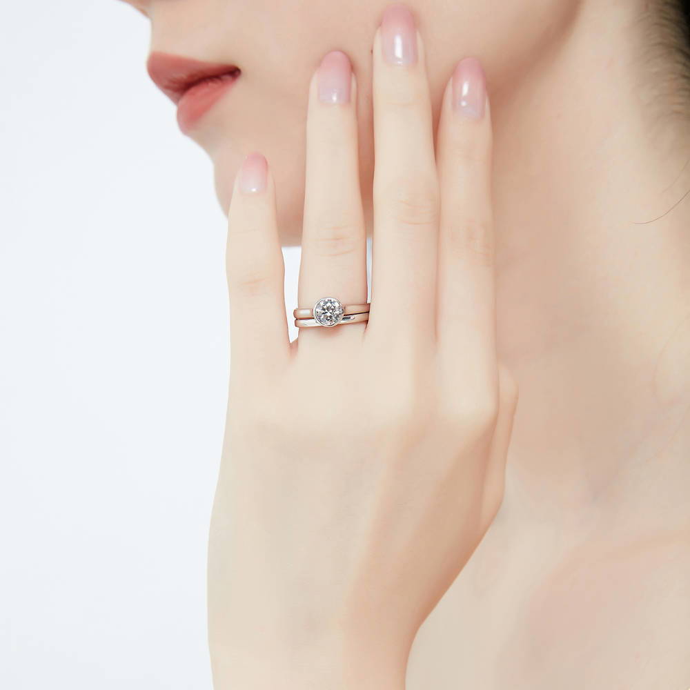 Model wearing Solitaire 0.8ct Bezel Set Round CZ Ring Set in Sterling Silver, 2 of 12
