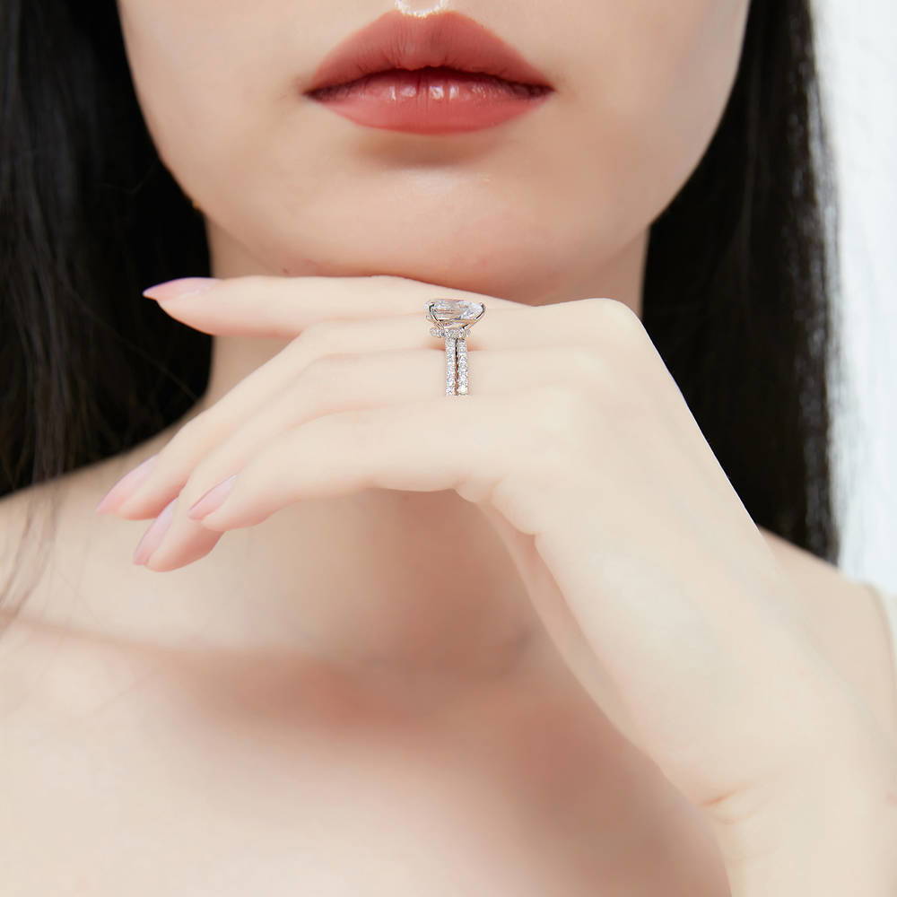Model wearing Solitaire Hidden Halo 1.8ct Pear CZ Ring Set in Sterling Silver, 7 of 12