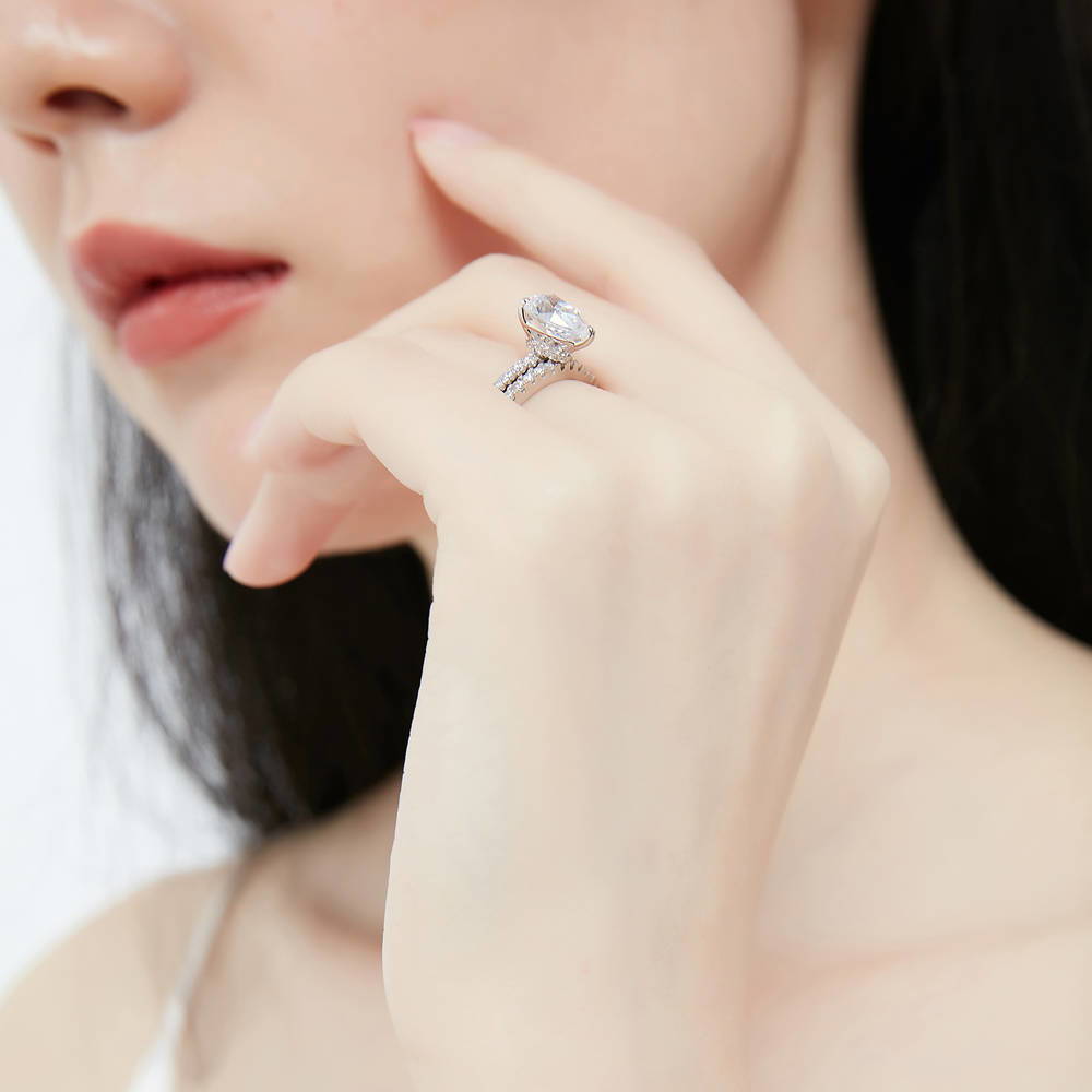 Model wearing Solitaire Hidden Halo 1.8ct Pear CZ Ring Set in Sterling Silver, 6 of 12