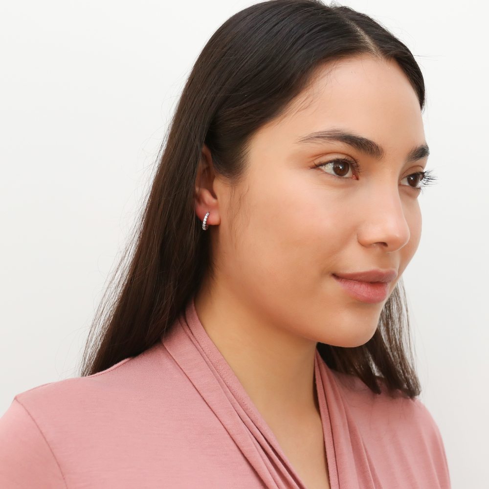 Model wearing 7-Stone CZ Small Hoop Earrings in Sterling Silver 0.6 inch, 3 of 6