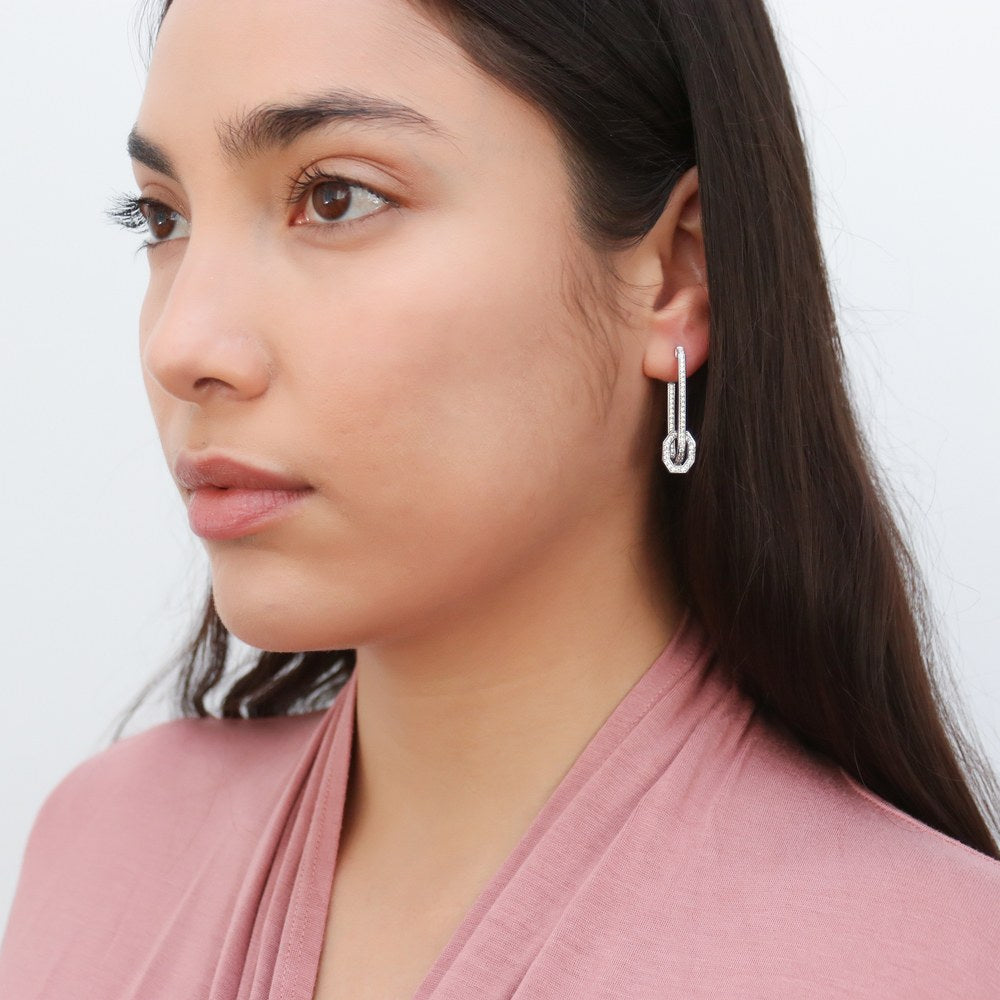 Model wearing Rectangle CZ Inside-Out Hoop Earrings in Sterling Silver 1.3 inch, 3 of 4