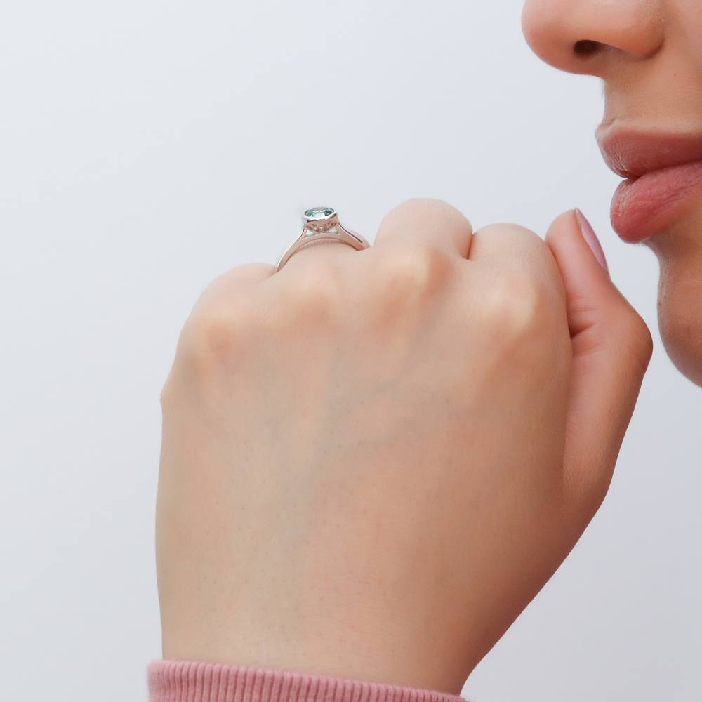 Model wearing Solitaire 0.8ct Green Bezel CZ Ring Set in Sterling Silver, 9 of 10