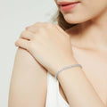 Model wearing CZ Tennis Bracelet in Sterling Silver 4-9 inch, Greyish Blue Color