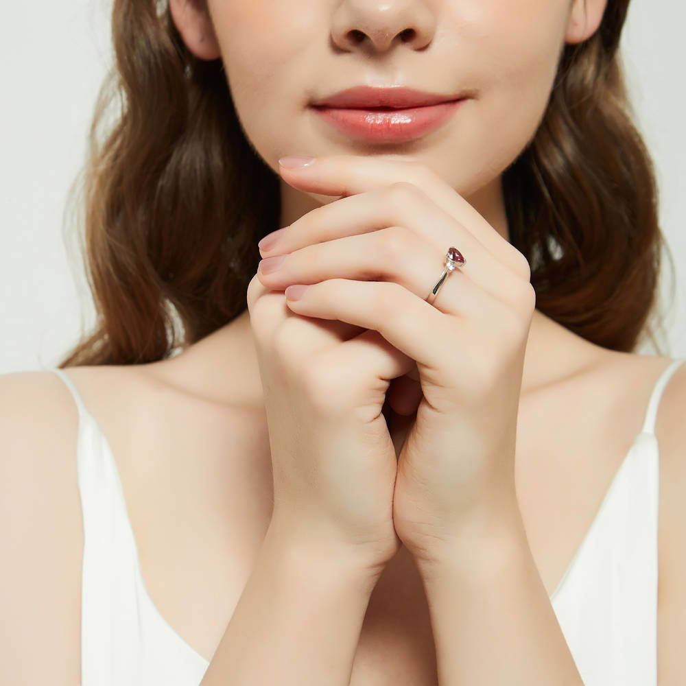 Model wearing 3-Stone Heart 0.7ct Red Heart CZ Ring Set in Sterling Silver, 13 of 17