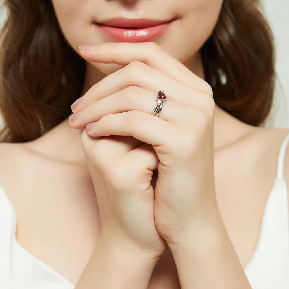 Model wearing 3-Stone Heart 0.7ct Red Heart CZ Ring Set in Sterling Silver, 7 of 17