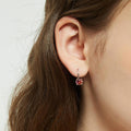 Model wearing Kaleidoscope Solitaire CZ Leverback Earrings in Sterling Silver, Red Orange Color