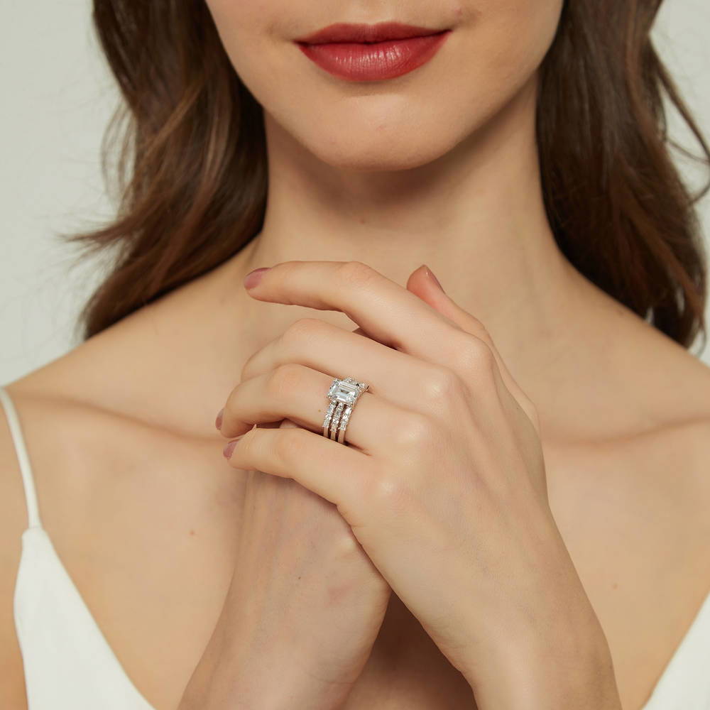 Model wearing Solitaire Art Deco Emerald Cut CZ Ring Set in Sterling Silver, 7 of 17