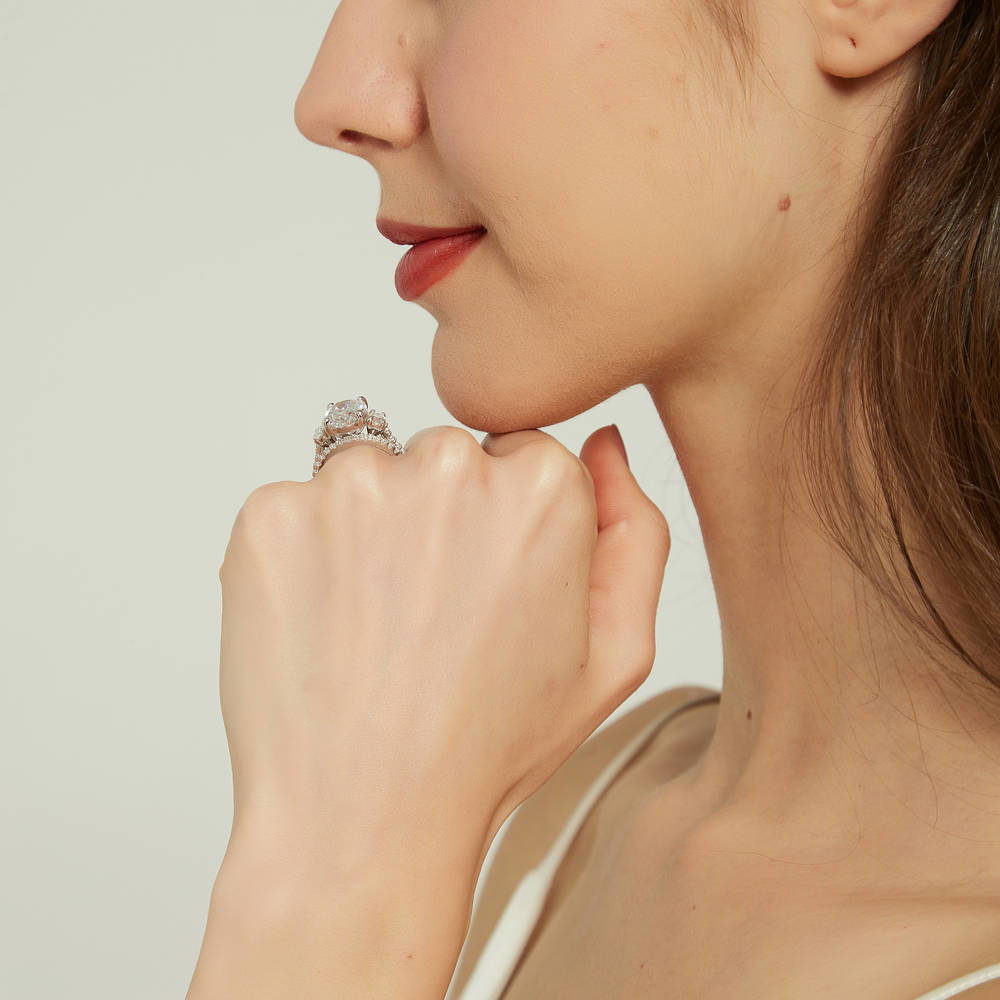 Model wearing 3-Stone 5.5ct Oval CZ Ring Set in Sterling Silver, 9 of 16