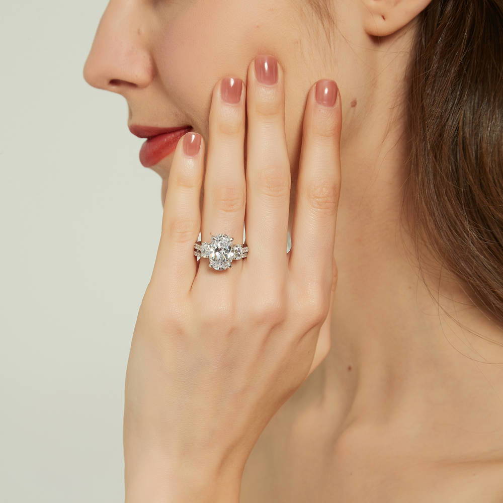 Model wearing 3-Stone 5.5ct Oval CZ Ring Set in Sterling Silver, 2 of 16