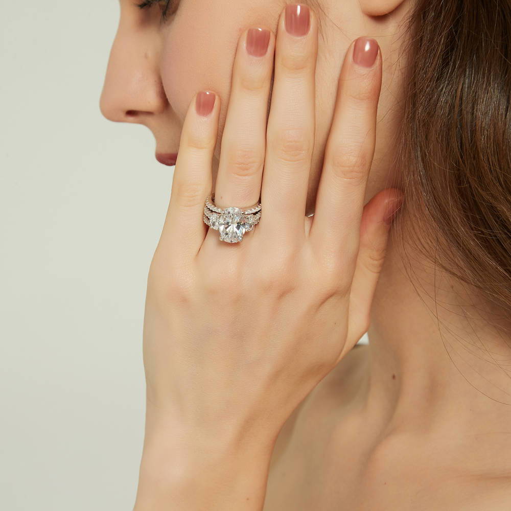 Model wearing 3-Stone 5.5ct Oval CZ Ring Set in Sterling Silver, 6 of 16