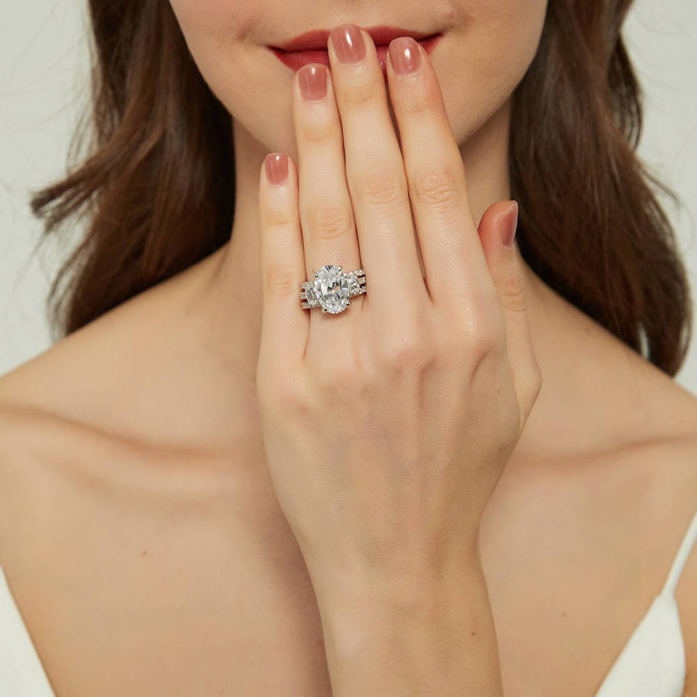 Model wearing 3-Stone 5.5ct Oval CZ Ring Set in Sterling Silver, 2 of 16