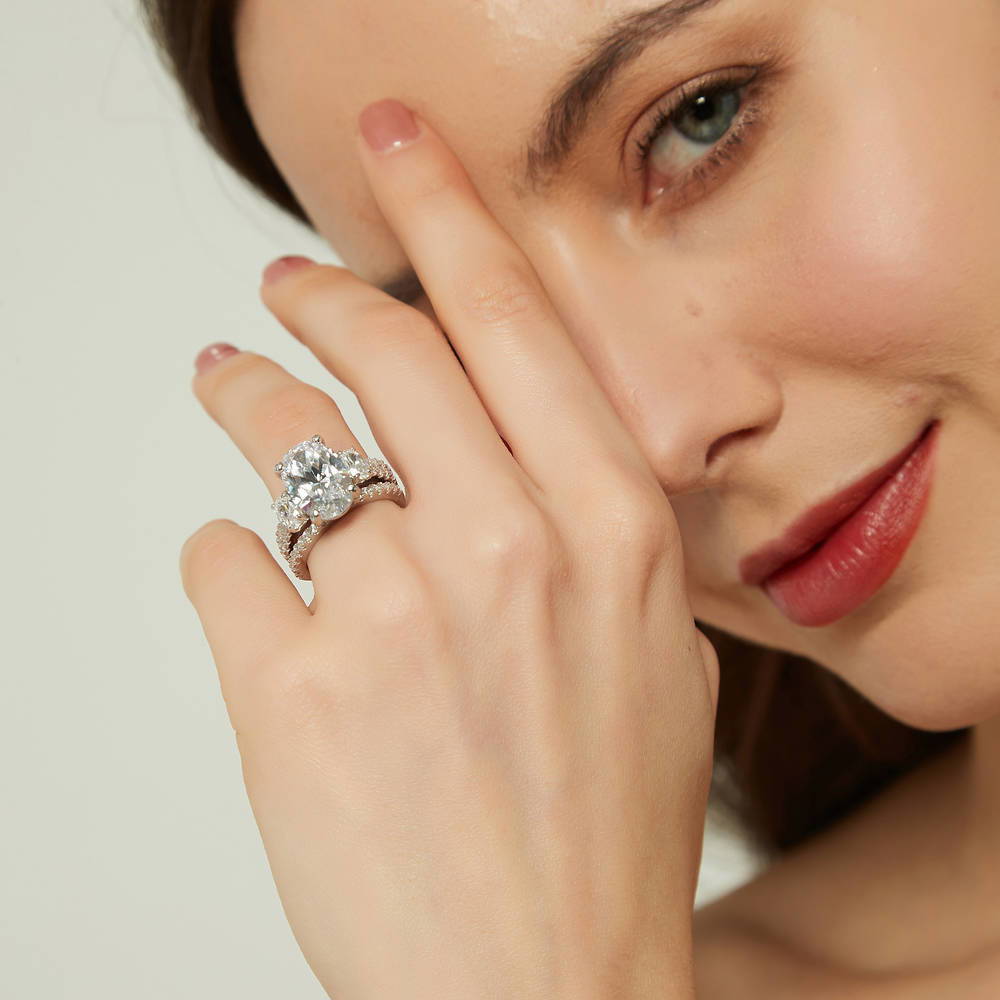 Model wearing 3-Stone 5.5ct Oval CZ Ring Set in Sterling Silver, 7 of 16