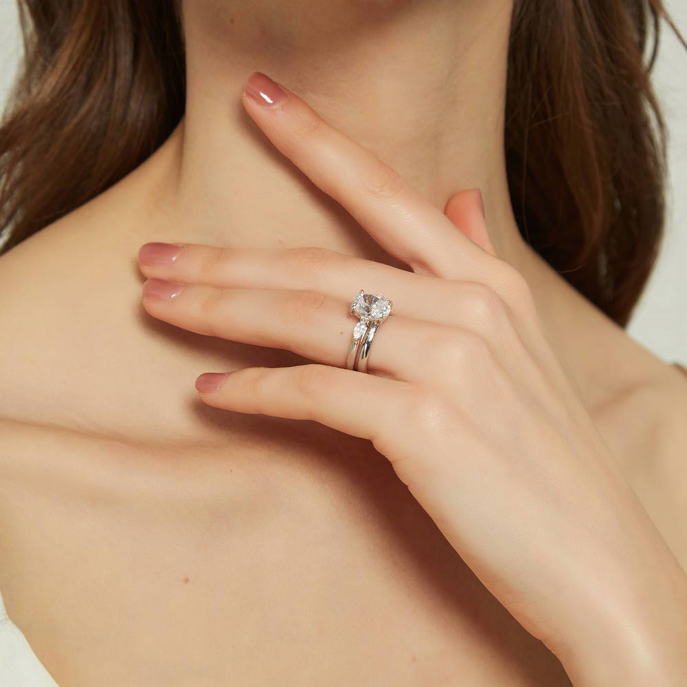 Model wearing 3-Stone 2.5ct Oval CZ Ring Set in Sterling Silver, 3 of 13