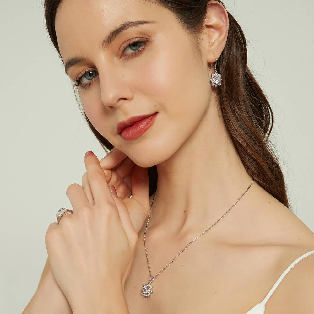 Model wearing Flower Halo CZ Ring in Sterling Silver, 9 of 12