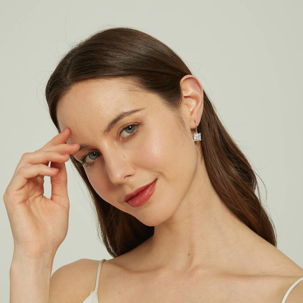 Model wearing Solitaire 6ct Princess CZ Leverback Earrings in Sterling Silver, 3 of 5