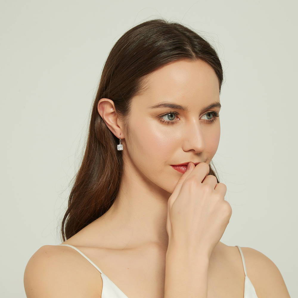 Model wearing Solitaire 6ct Cushion CZ Leverback Earrings in Sterling Silver, 5 of 5