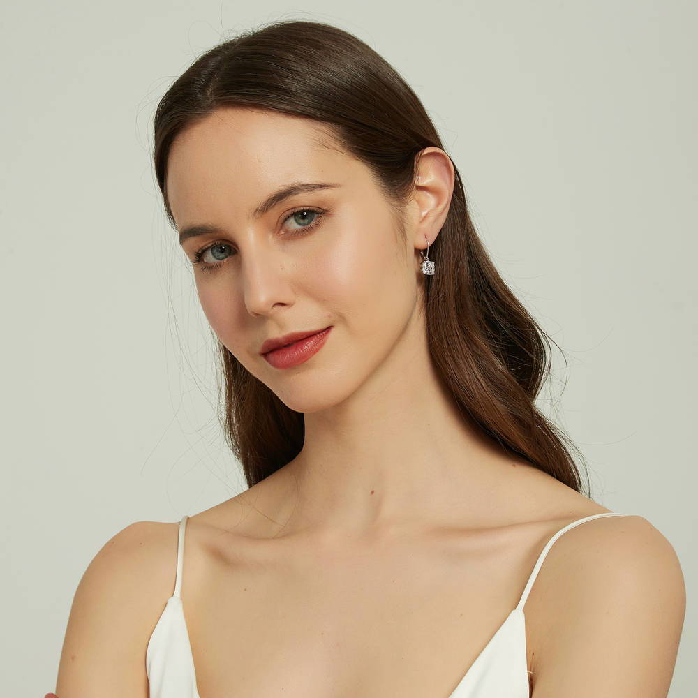 Model wearing Solitaire 6ct Cushion CZ Leverback Earrings in Sterling Silver, 4 of 5