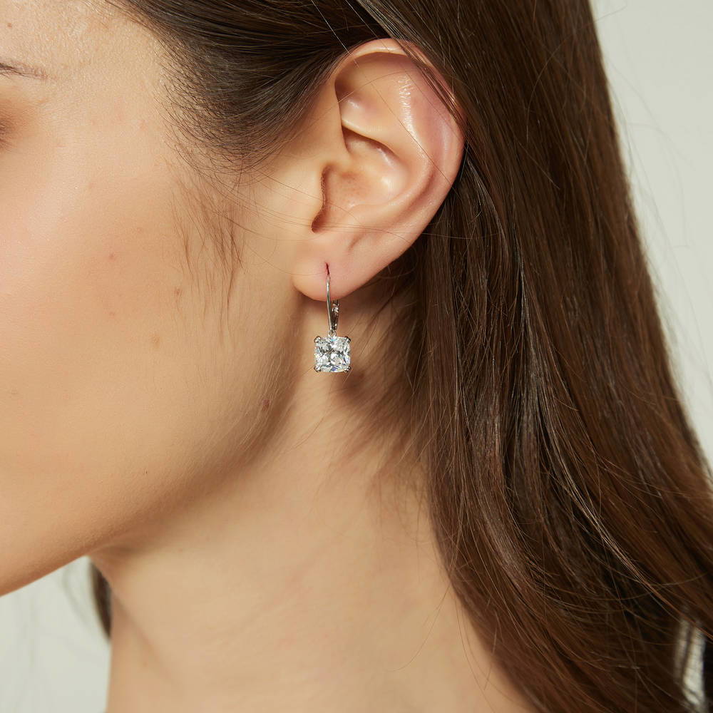 Model wearing Solitaire 6ct Cushion CZ Leverback Earrings in Sterling Silver, 2 of 5