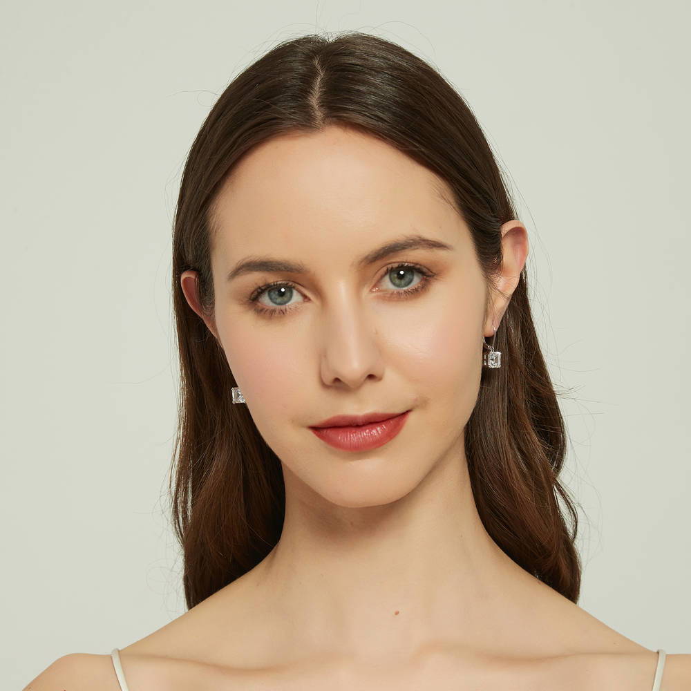Model wearing Solitaire 6ct Asscher CZ Leverback Earrings in Sterling Silver, 5 of 5