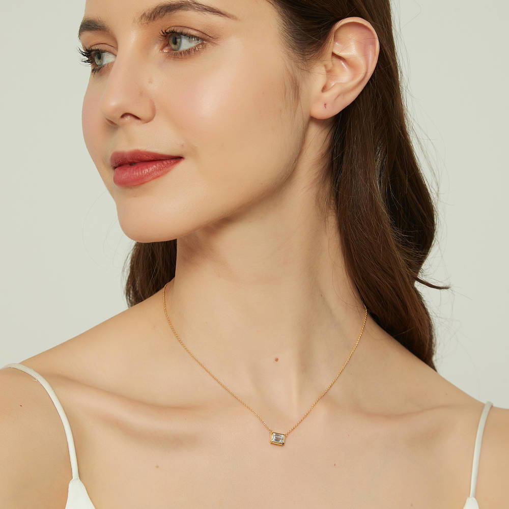 Model wearing Solitaire East-West CZ Necklace in Gold Flashed Sterling Silver, 3 of 8