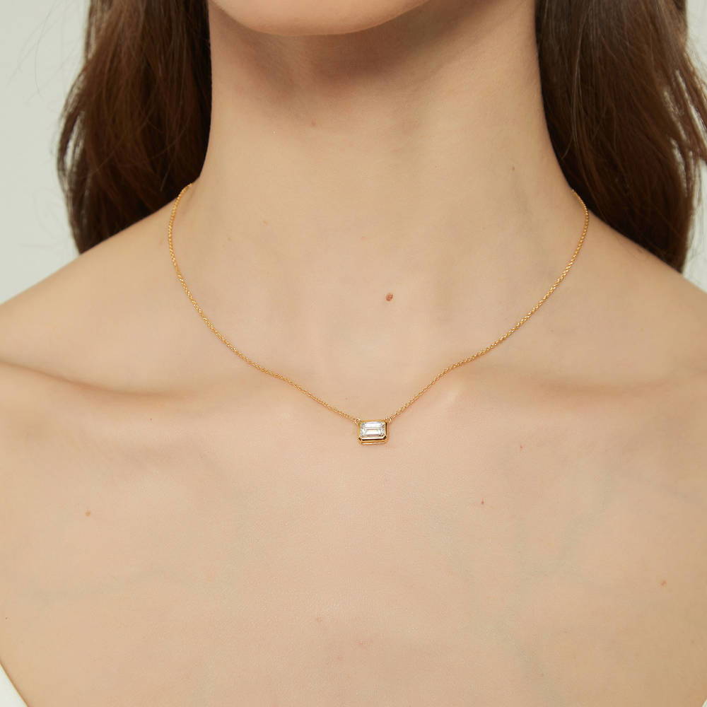 Model wearing Solitaire East-West CZ Necklace in Gold Flashed Sterling Silver, 2 of 8