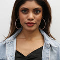 Model wearing CZ Large Inside-Out Hoop Earrings in Sterling Silver 2.5 inch, Rose Gold Flashed