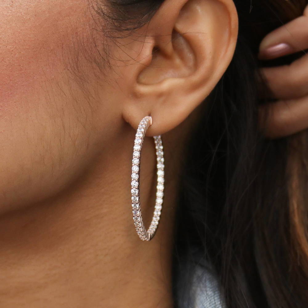 Model wearing CZ Inside-Out Hoop Earrings in Sterling Silver 1.8 inch, Rose Gold Flashed