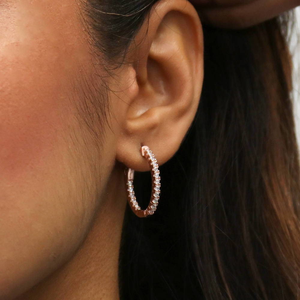Model wearing Oval CZ Small Inside-Out Hoop Earrings in Sterling Silver 0.8 inch, Rose Gold Flashed