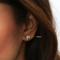 Model wearing Solitaire Asscher CZ Stud Earrings in Sterling Silver, 4mm