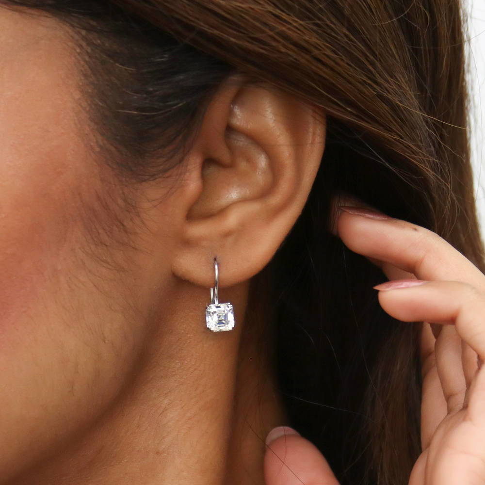 Model wearing Solitaire 3.2ct Asscher CZ Fish Hook Earrings in Sterling Silver, 3 of 8