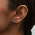 Model wearing Solitaire Kaleidoscope CZ Stud Earrings in Sterling Silver 2.5ct, Purple Aqua Color