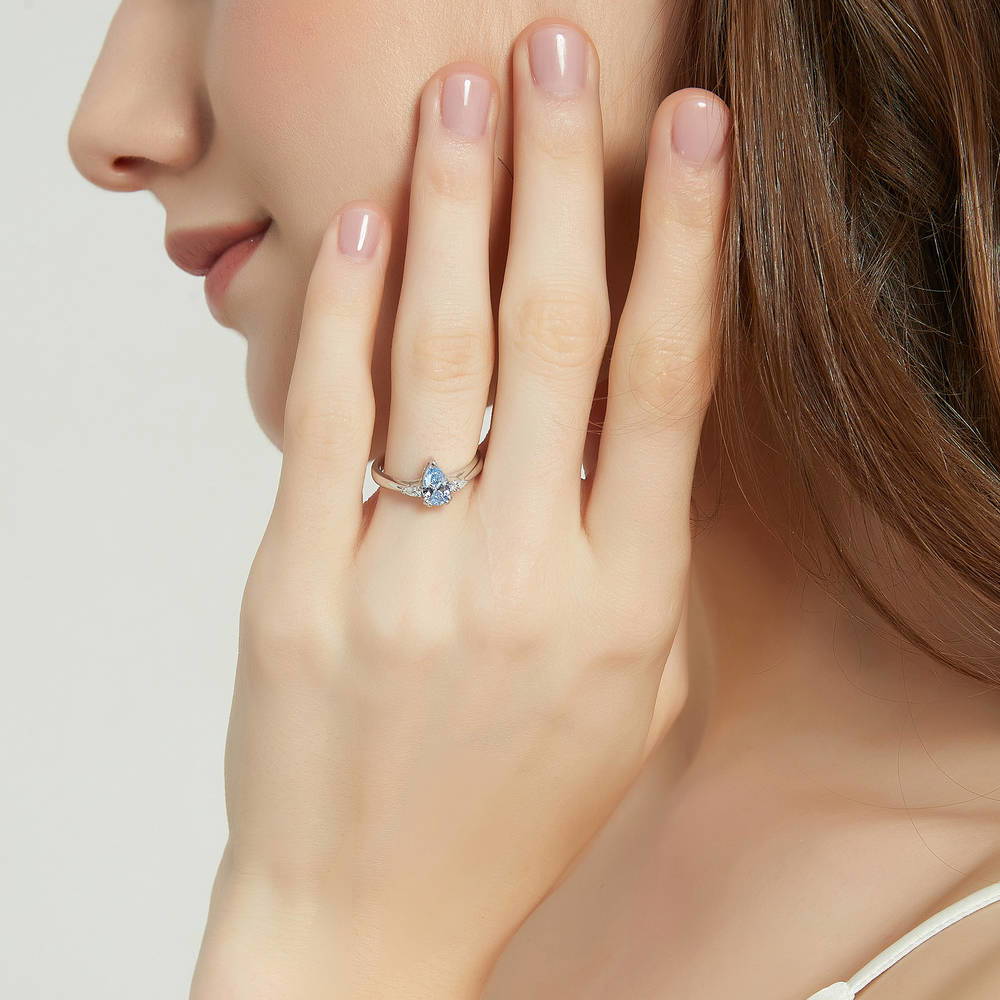 Model wearing 3-Stone 0.8ct Greyish Blue Pear CZ Ring in Sterling Silver, 2 of 8