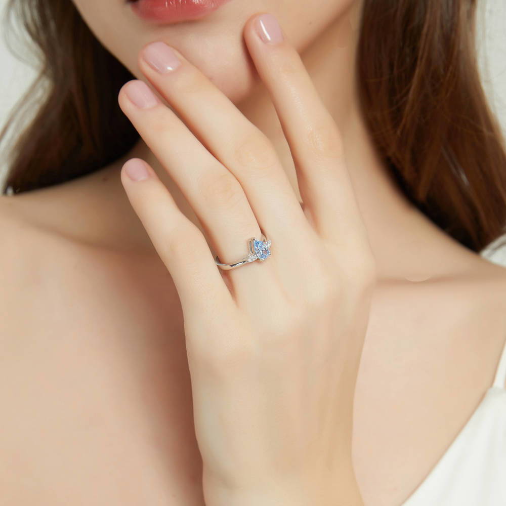 Model wearing 3-Stone 0.8ct Greyish Blue Pear CZ Ring in Sterling Silver, 3 of 8