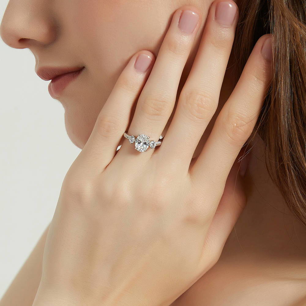 Model wearing 3-Stone Cable 1.8ct Oval CZ Ring in Sterling Silver, 2 of 9