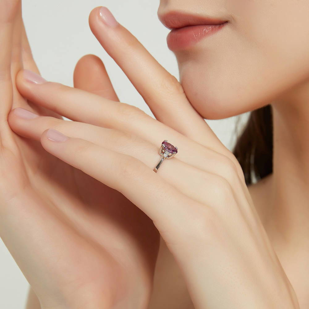 Model wearing 3-Stone 1.2ct Purple Oval CZ Ring in Sterling Silver, 3 of 8