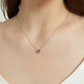 Model wearing Solitaire Kaleidoscope Bezel CZ Necklace in Sterling Silver 0.8ct, Purple Aqua Color