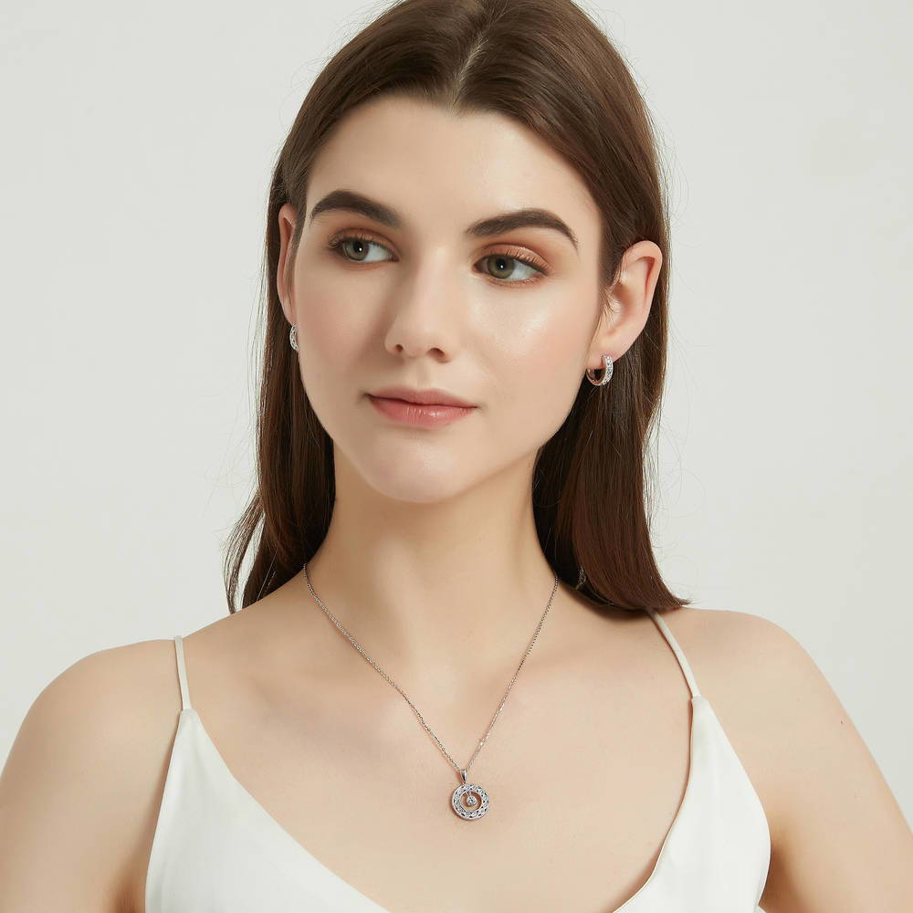 Model wearing Open Circle Woven CZ Necklace and Hoop Earrings Set in Sterling Silver, 3 of 11