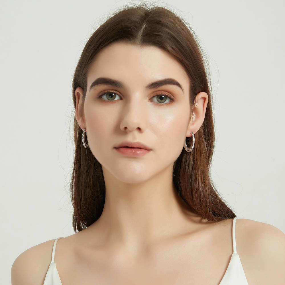 Model wearing Oval Bar Filigree CZ Small Hoop Earrings in Sterling Silver 1 inch, 3 of 4