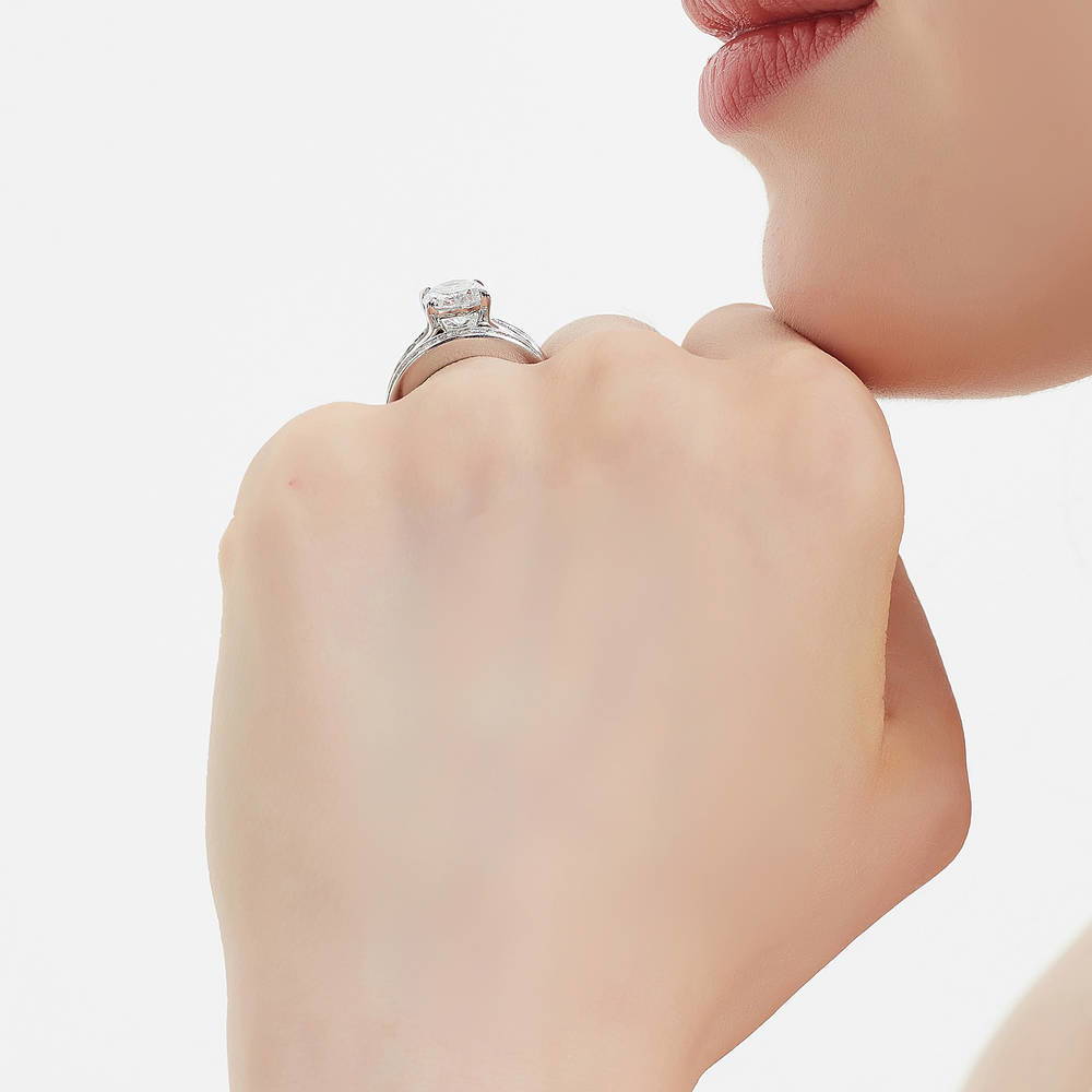 Model wearing Solitaire 2.5ct Oval CZ Ring Set in Sterling Silver, 7 of 16