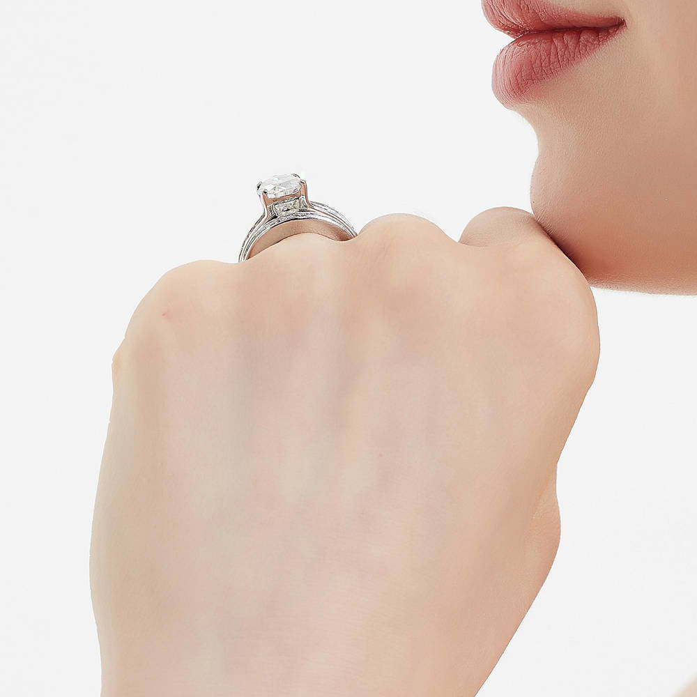 Model wearing Solitaire 3ct Pear CZ Ring Set in Sterling Silver, 7 of 17