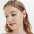 Model wearing Cross CZ Stud Earrings in Sterling Silver, Red Color