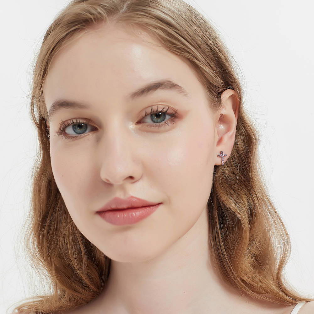 Model wearing Cross CZ Stud Earrings in Sterling Silver, Green Color