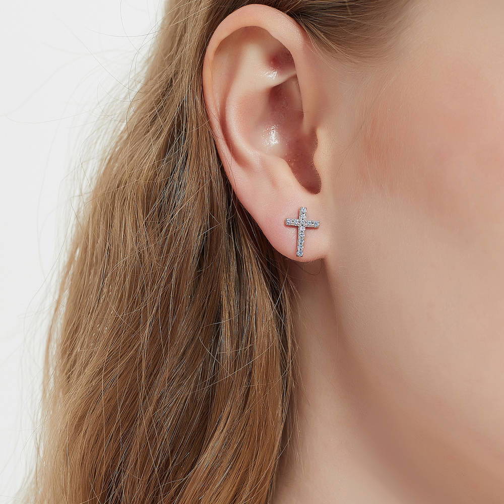 Model wearing Cross CZ Stud Earrings in Sterling Silver, Green Color