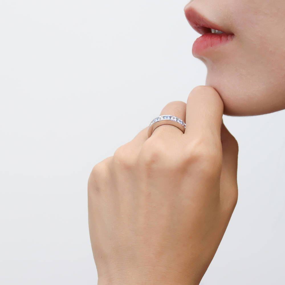 Model wearing Greyish Blue Channel CZ Eternity Ring in Sterling Silver, 6 of 8