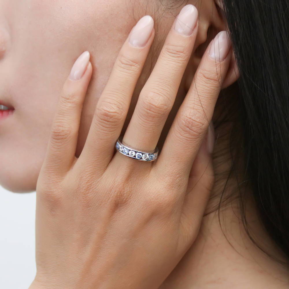 Model wearing Greyish Blue Channel CZ Eternity Ring in Sterling Silver, 3 of 8