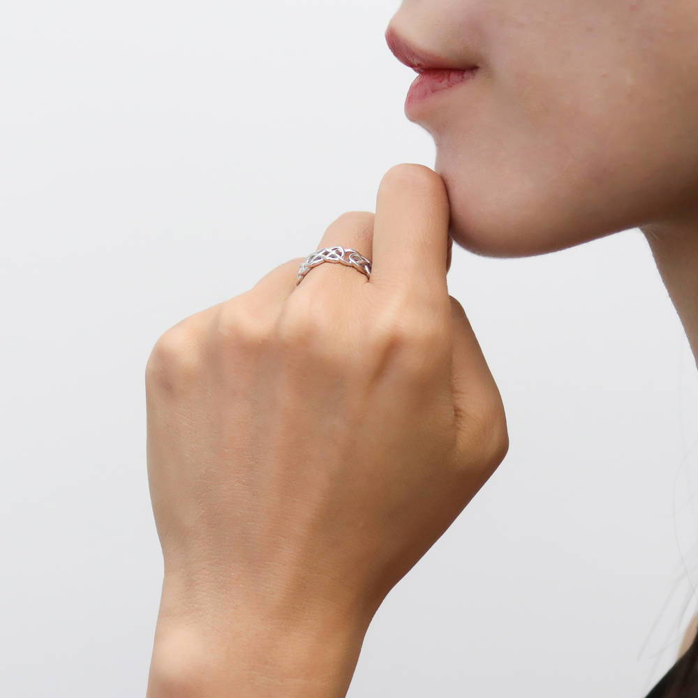 Model wearing Woven Celtic Knot Band in Sterling Silver, 3 of 7