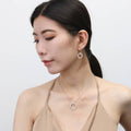 Model wearing Open Circle CZ Necklace in Sterling Silver, Rhodium Plated