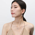 Model wearing Open Circle CZ Necklace in Sterling Silver, Yellow Gold Flashed