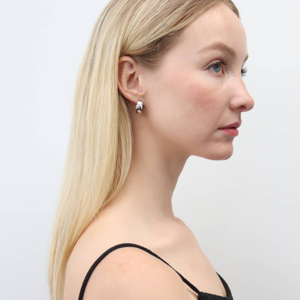 Model wearing Dome Small Hoop Earrings in Sterling Silver 0.7 inch, 2 of 5
